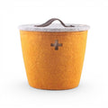 Baabuk small honey yellow felted wool basket with a grey lid, leather handle, and Swiss cross cutout detail.