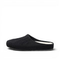 Baabuk Alpina minimalist black wool slip-on sandal with a cork insole and rubber outsole, side view.