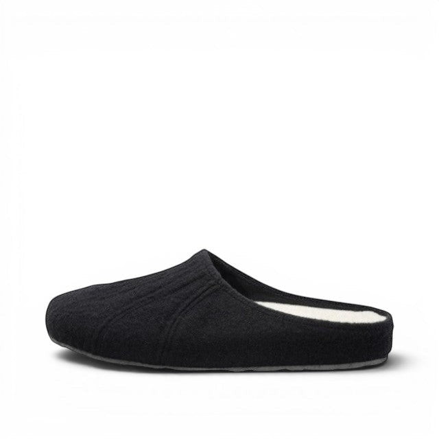 Baabuk Alpina minimalist black wool slip-on sandal with a cork insole and rubber outsole, side view.