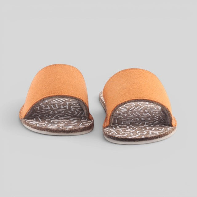 Baabuk Baabulette terracotta wool slide sandals with patterned footbed and natural crepe rubber soles.