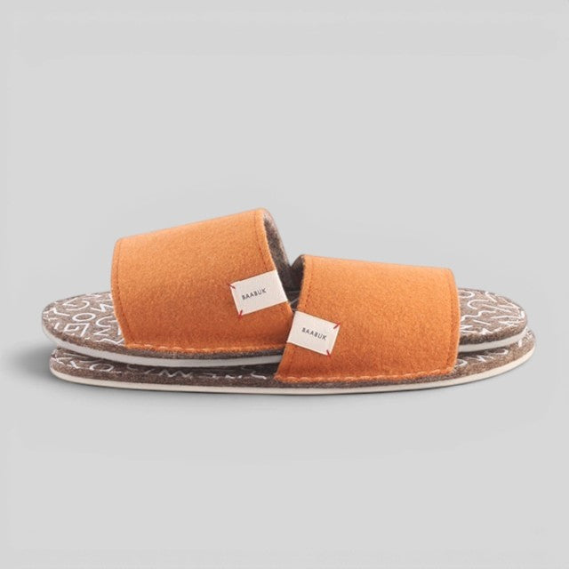 Baabuk Baabulette terracotta wool slide sandals with natural crepe rubber soles and artisanal branding tags.