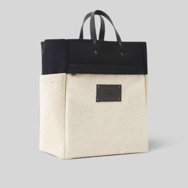 Baabuk BBB Bag in black and cream burel wool with leather handles and Blacknose Collection label.
