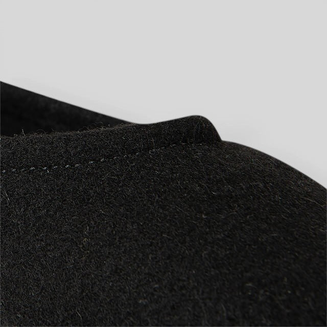 Baabuk black wool ballerina flat shoe featuring soft natural sheep wool upper and durable construction.