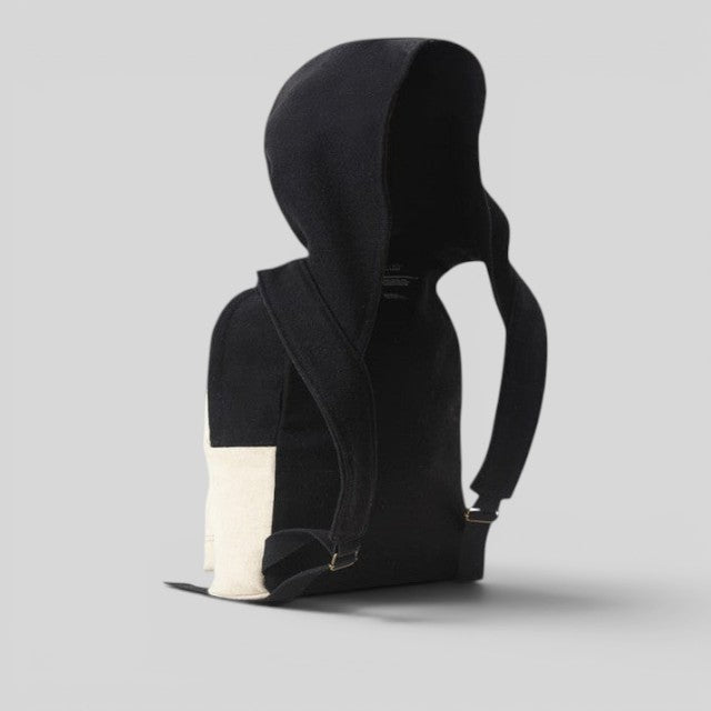 Baabuk Blacknose hooded backpack in black and cream wool with adjustable shoulder straps and outer compartment.
