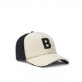 Baabuk Blacknose baseball cap in cream and black wool with an embroidered letter B and adjustable leather strap.