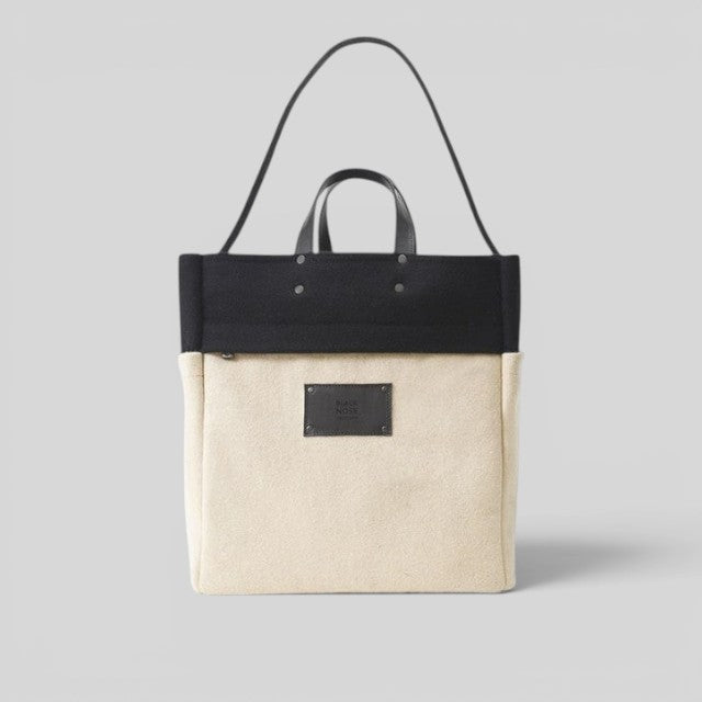 Baabuk BBB Bag Blacknose tote made of cream and black burel wool with leather handles and shoulder strap.
