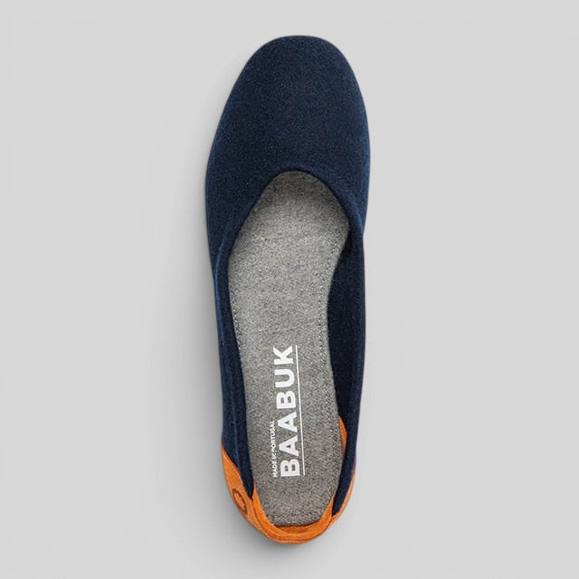 Baabuk blue wool ballerina flat with grey wool insole and tan nubuck heel detail, top-down view.