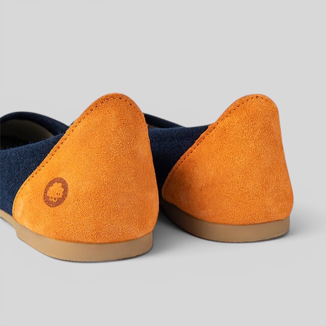 Baabuk blue wool ballerina flats featuring orange nubuck heel accents and a durable rubber sole.