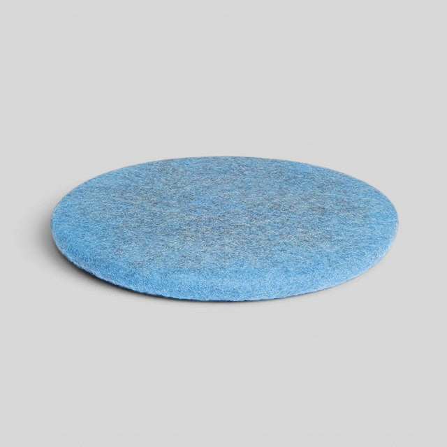 Baabuk handmade blue circular wool sitting mat made from natural New Zealand wool with upcycled inner stuffing.