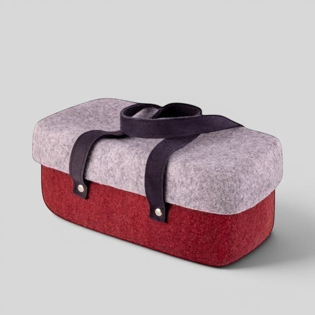 Baabuk Bordeaux wool beer cooler with a grey lid, red base, and dark leather carrying straps.