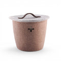 Baabuk small brown felted wool basket with a Swiss cross cutout and a leather handle lid.