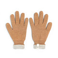 Baabuk camel-colored baby alpaca wool gloves with a reversible light grey cuff and small brand tag.