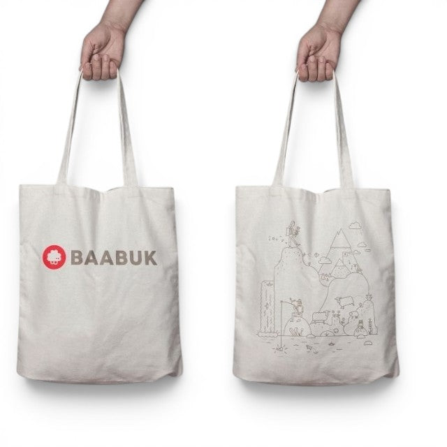 Baabuk canvas tote bag featuring a Swiss-inspired line art illustration of mountains and sheep on a cream background.