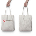 Baabuk canvas tote bag featuring a Swiss-inspired line art illustration of mountains and sheep on a cream background.