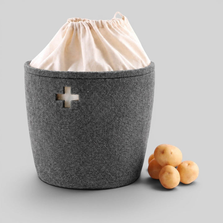 Baabuk large dark grey felted wool basket with a Swiss cross cutout and cream fabric drawstring liner.