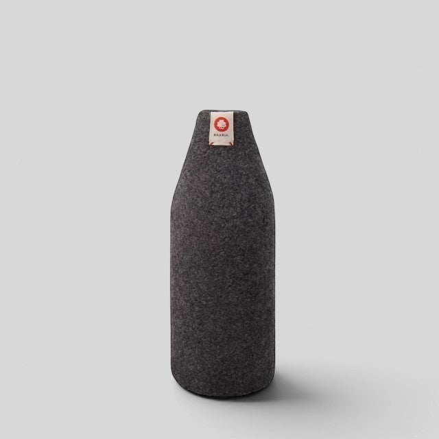 Baabuk dark grey wool bottle cover with natural insulation and a small branded tag on a light grey background.