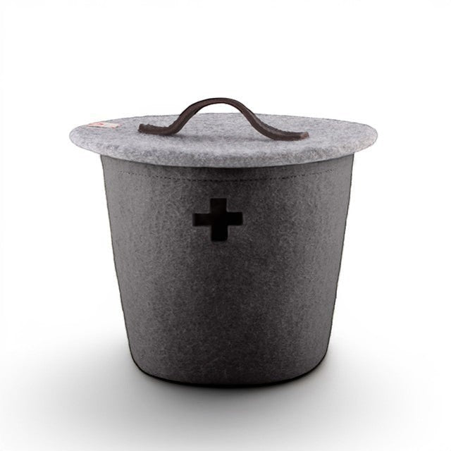 Baabuk large dark grey felted wool storage basket with a leather handle and Swiss cross cutout detail.