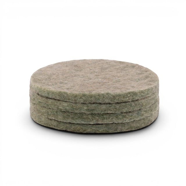 Baabuk set of four round khaki felted wool coasters for furniture protection on a white background.
