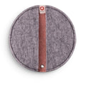 Baabuk round felted wool potholder in grey with a pink center stripe and leather hanging loop