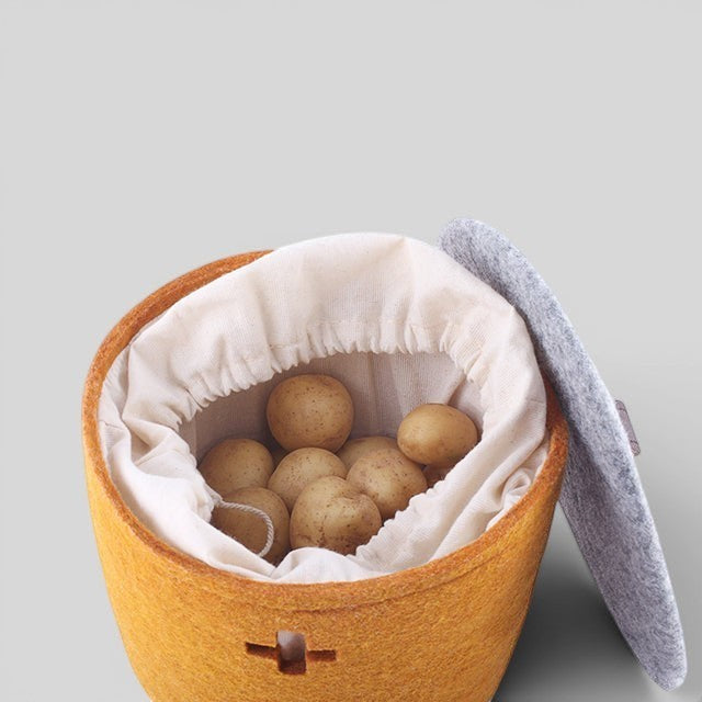 Baabuk small honey felted wool basket with a removable fabric liner and grey lid, perfect for kitchen storage.