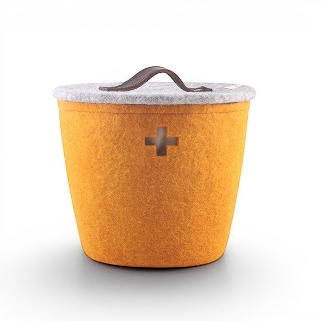 Baabuk honey felted wool storage basket with a grey lid, leather handle, and Swiss cross cutout detail.