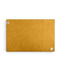 Baabuk honey yellow rectangular felted wool table mat with a small Swiss cross cutout detail.