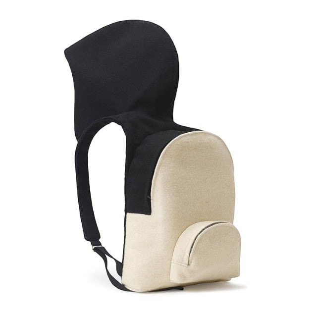 Baabuk Blacknose hooded backpack in cream and black wool with adjustable straps and a small front pocket.