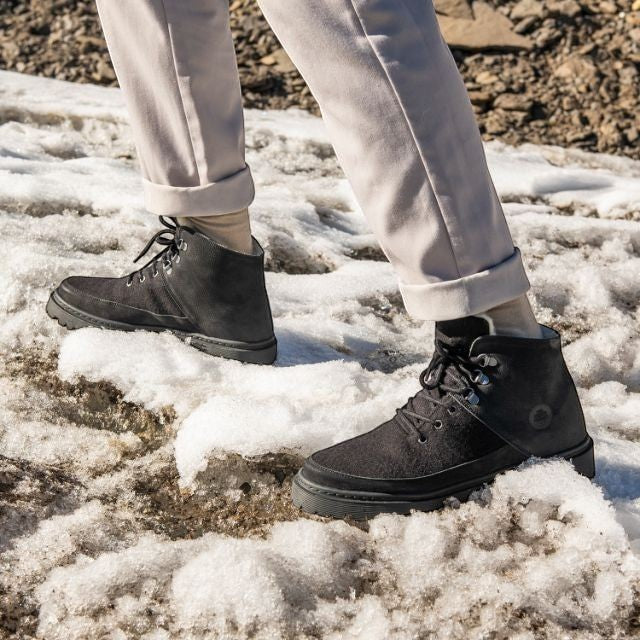Baabuk Ice Wooler black wool boots with nubuck details worn on snowy ground