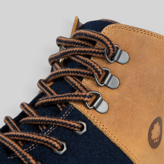 Baabuk Ice Wooler navy and brown wool hiking boot detail featuring nubuck leather, metal eyelets, and striped laces.