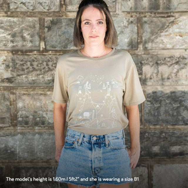 Model wearing a khaki Baabuk 100% merino wool T-shirt with a white Swiss-themed illustration by Jamie Aspinal.
