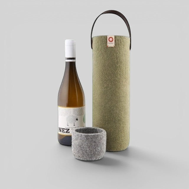 Baabuk khaki green wool wine cooler with leather strap and matching grey wool coaster next to a wine bottle