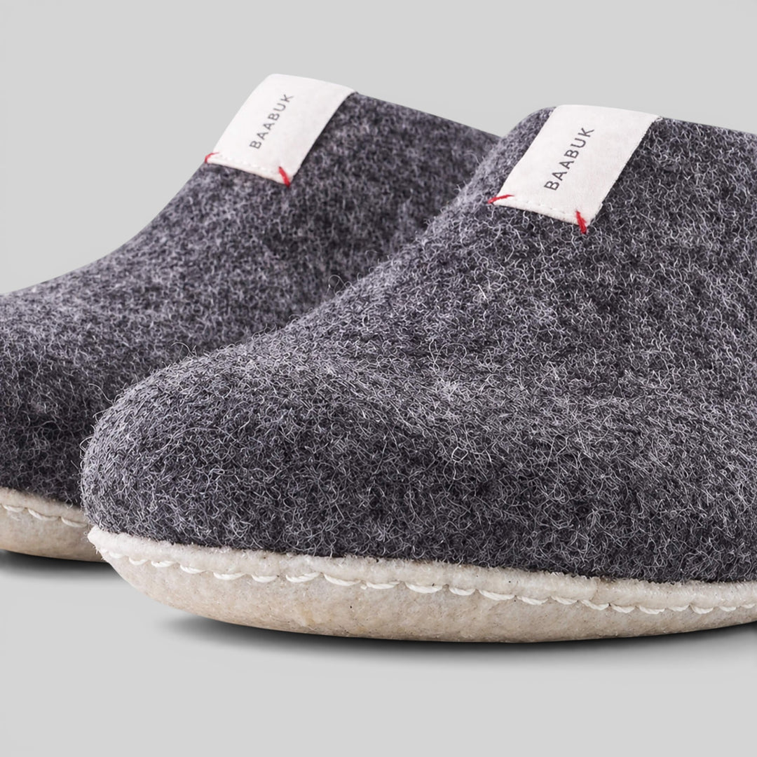 Baabuk Mel dark grey handmade wool slippers with natural crepe rubber soles and branded white heel tabs