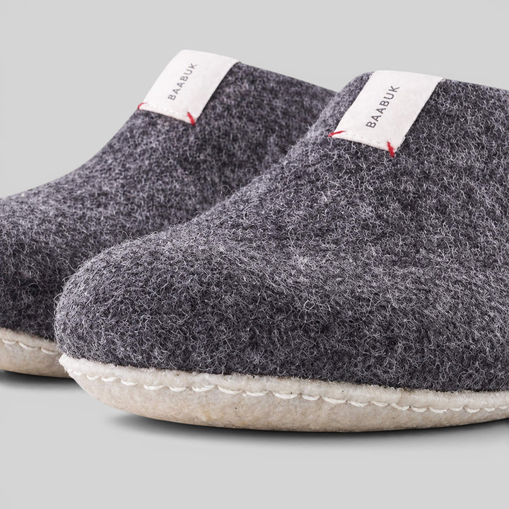 Baabuk Mel dark grey handmade wool slippers with natural crepe rubber soles and branded white heel tabs