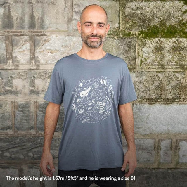 Model wearing a dark grey Baabuk 10th anniversary merino wool t-shirt with a white graphic illustration by Ana Seixas