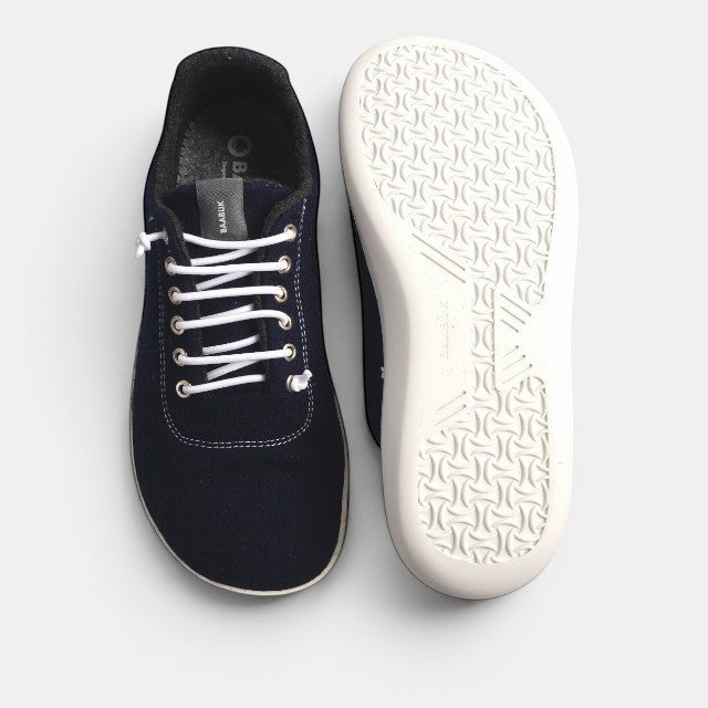 Baabuk navy blue wool low-top barefoot sneakers with white laces and a white rubber sole.