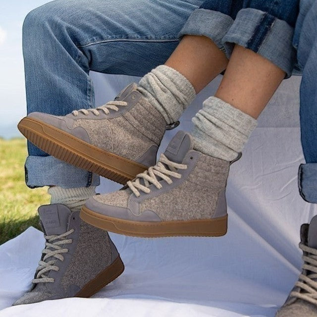 Baabuk Peaks Wooler sneakers in warm grey Pyrenean wool with rubber soles, worn with grey socks and blue jeans.