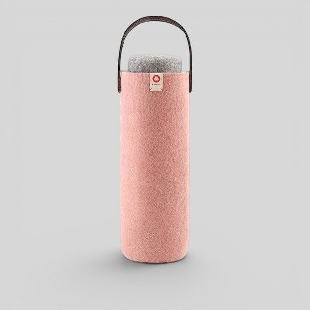 Baabuk pink wool wine cooler with a brown leather handle, designed for eco-friendly bottle insulation.