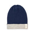Baabuk reversible beanie in marine blue and grey baby alpaca wool with a ribbed knit texture and branded side tag.