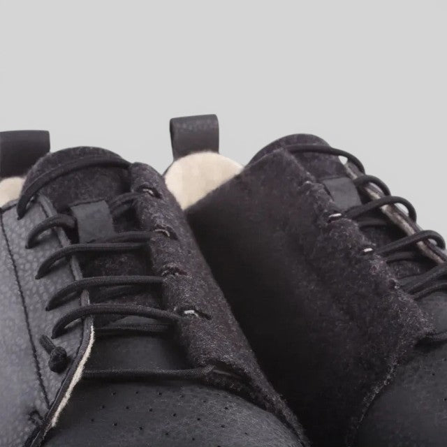 Baabuk Shunya Wooler black sneakers featuring textured wool and plant-based leather panels with elastic laces.