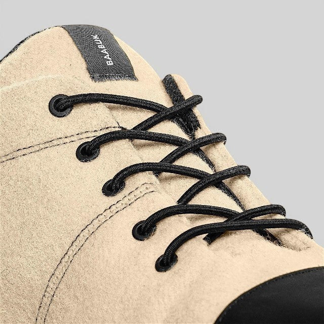 Baabuk Sky Wooler Blacknose sneaker in beige wool with black elastic laces and a black nubuck toe cap detail.
