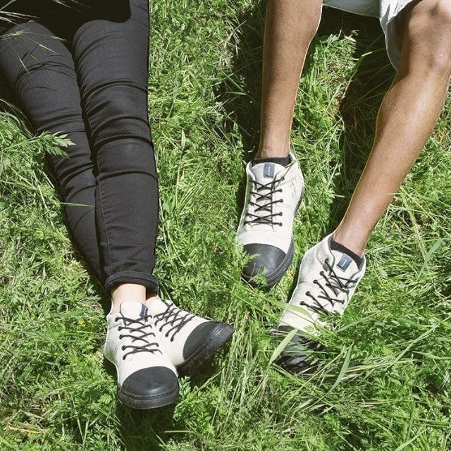 Baabuk Sky Wooler Blacknose sneakers in off-white wool with black rubber toes and laces worn on green grass