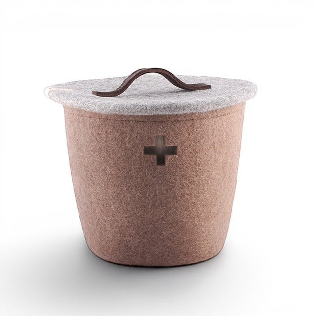 Baabuk small brown felted wool basket with a grey lid, leather handle, and Swiss cross cutout detail.