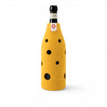 Baabuk yellow wool bottle cover with Swiss cheese hole design, providing natural insulation for a wine bottle.
