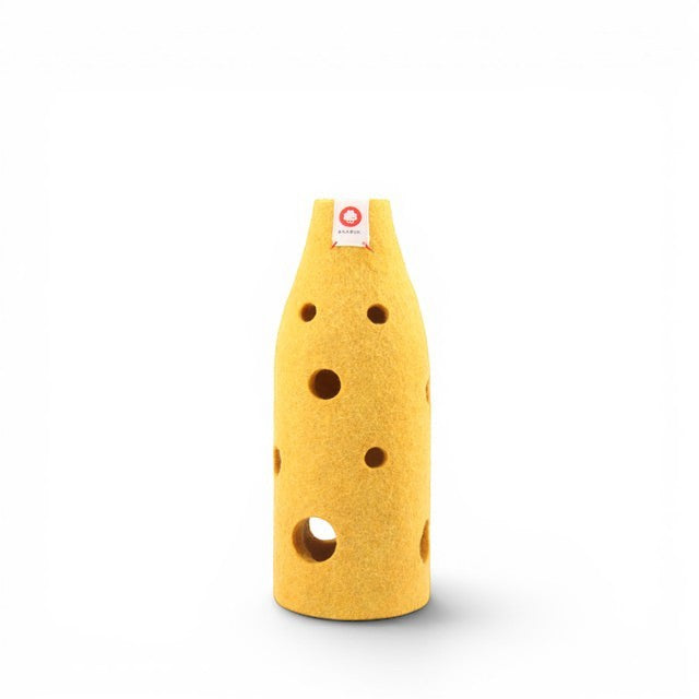 Baabuk yellow wool bottle cover with Swiss cheese hole design, handcrafted for natural drink insulation.