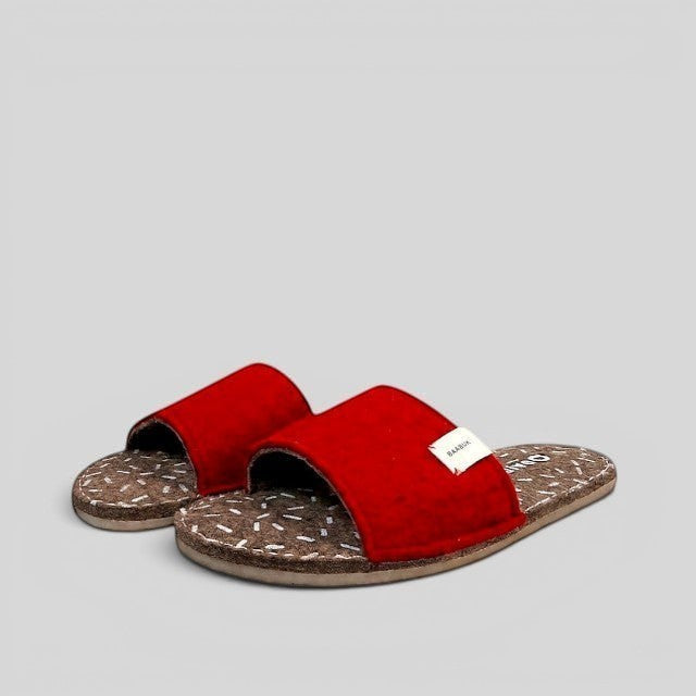 Baabuk Baabulette wool slide sandals in Swiss Red with a patterned compressed wool footbed and crepe rubber sole.