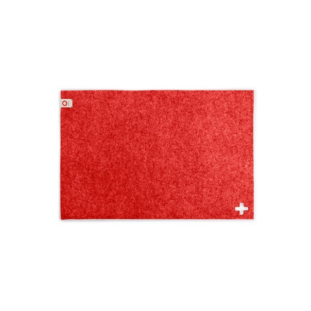 Baabuk rectangular Swiss red felted wool table mat with a small white cross detail on a white background.