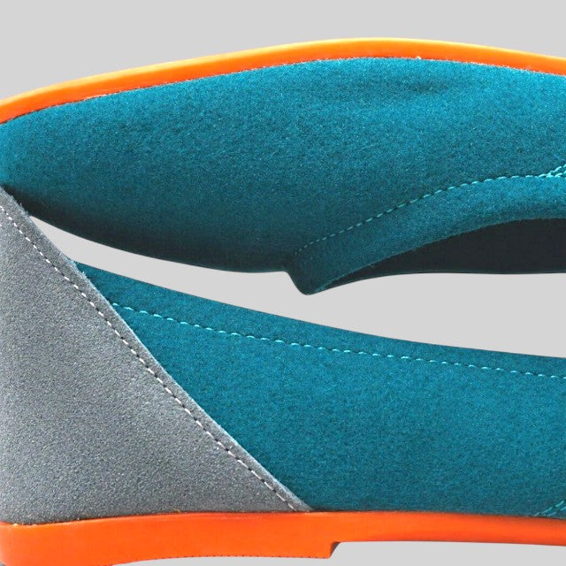 Baabuk teal wool ballerina flats featuring grey nubuck heel detail and vibrant orange rubber soles.
