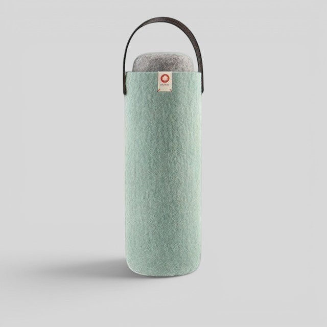 Baabuk turquoise wool wine cooler with a brown leather strap for portable, eco-friendly bottle insulation.