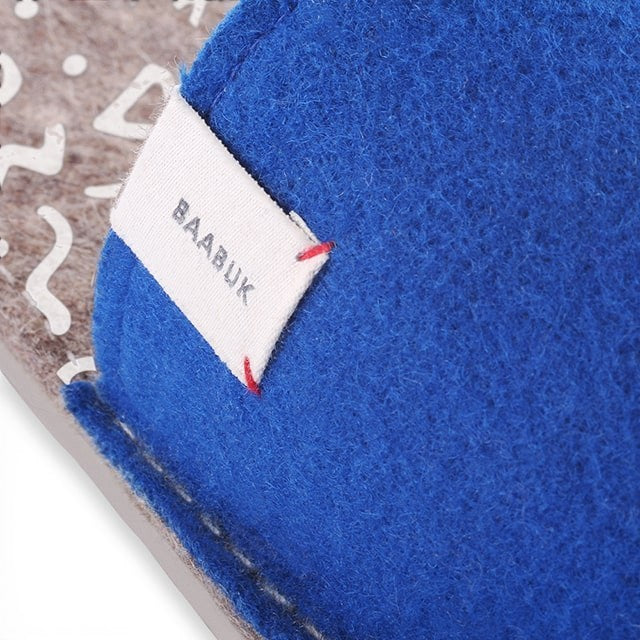 Baabuk Baabulette wool slide sandals in ultra marine blue with a branded fabric tag and patterned footbed.