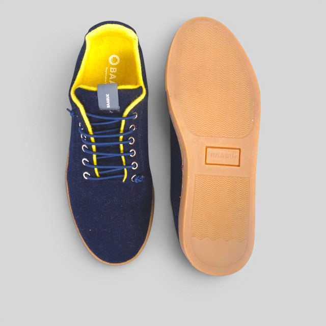 Baabuk Urban Wooler sneakers in navy blue wool with bright yellow lining and durable gum rubber soles.